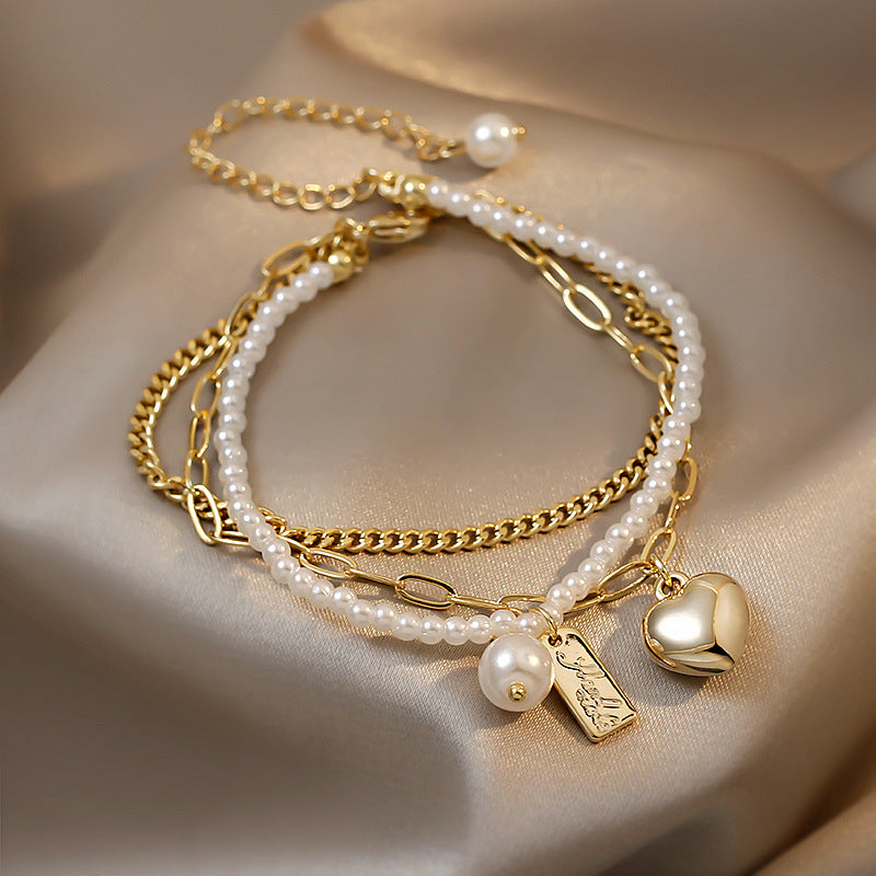 Buy Online Premimum Quality, Trendy and Highly Comfortable Pearl Multilayer Love Bracelet - FEYONAS