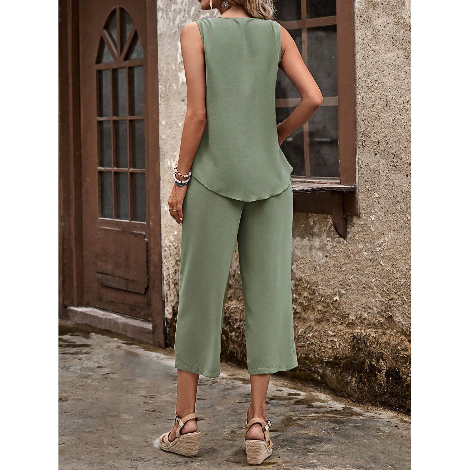  trendy sleeveless camisole top with a modern asymmetrical hemline